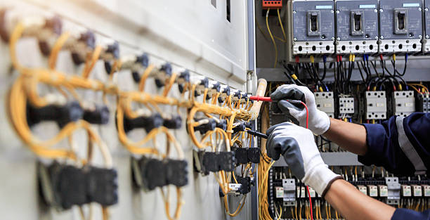 Professional Electrician technician working in Palm Beach Gardens, FL